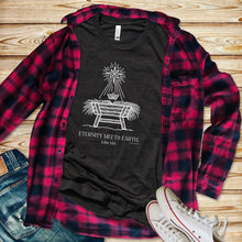 Load image into Gallery viewer, Eternity Meets Earth” Faith-Based Christmas T-Shirt – Minimal Christian Graphic Tee on Bella+Canvas 3001
